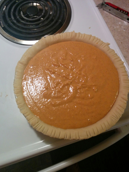 Pumpkin pie waiting to be put in the oven